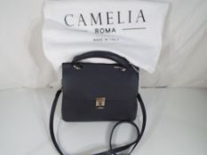 Camelia - a lady's good quality grey handbag marked Camelia Roma with dust cover (unused)