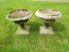 A pair of stone planters approx 35cm (h) x 39cm (diam) (2)