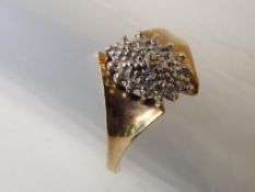A lady's yellow metal diamond ring stamped 10K, size U + 1/2, approx weight 3.