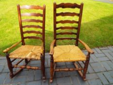 A pair of oak rocking chairs