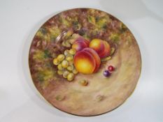 Royal Worcester - a large plate hand painted with depictions of peaches and grapes signed B Cox