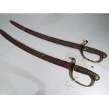Two 18th century British Naval boarding short sabres with chagrin wired grip and brass hand guards,