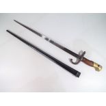 A 19th century French bayonet and steel scabbard,