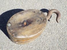 An early wooden double pulley block with hook,