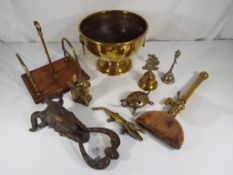 A good mixed lot of ornamental brassware to include a brass twin-handled centrepiece,