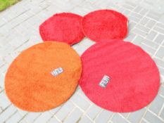 Four good quality circular floor rugs,