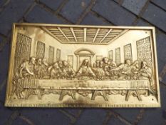 A good quality brass wall plaque with relief decoration of The Last Supper,
