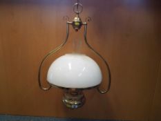 A good quality brass and glass ceiling light with opaque shade