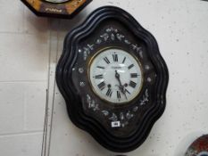 A French vineyard wall clock with mother of pearl inlay, Roman numerals on a white dial inscribed P.