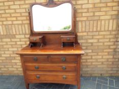 A chest of drawers two over two with mirror,