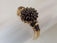 A lady's hallmarked 9 carat gold and 0.50 ct black diamond cluster ring, approximate weight 2.