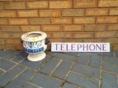 An antique ceramic two-handled leech jar (missing lid) and an original perspex telephone sign.