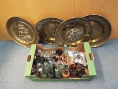 A quantity of vintage glass bottles, some advertising bottles and stoneware bottles,