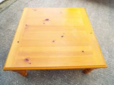 A good quality pine coffee table approximately 40 cm x 94 cm x 90 cm