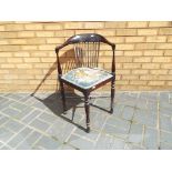 An antique slat back corner chair with u