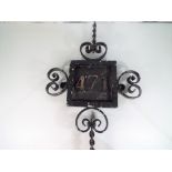 A cast metal house sign 67 cm x 39 cm