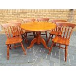 A good quality round pine dining table w