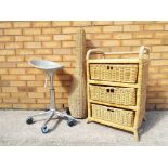 A wicker chest of drawers, a wicker lamp