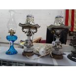 A pair of ceramic table lamps and a glas