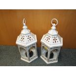 A pair of garden lanterns. Estimate £15