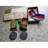 World War Two (WW2) two Defence medals with ribbons.