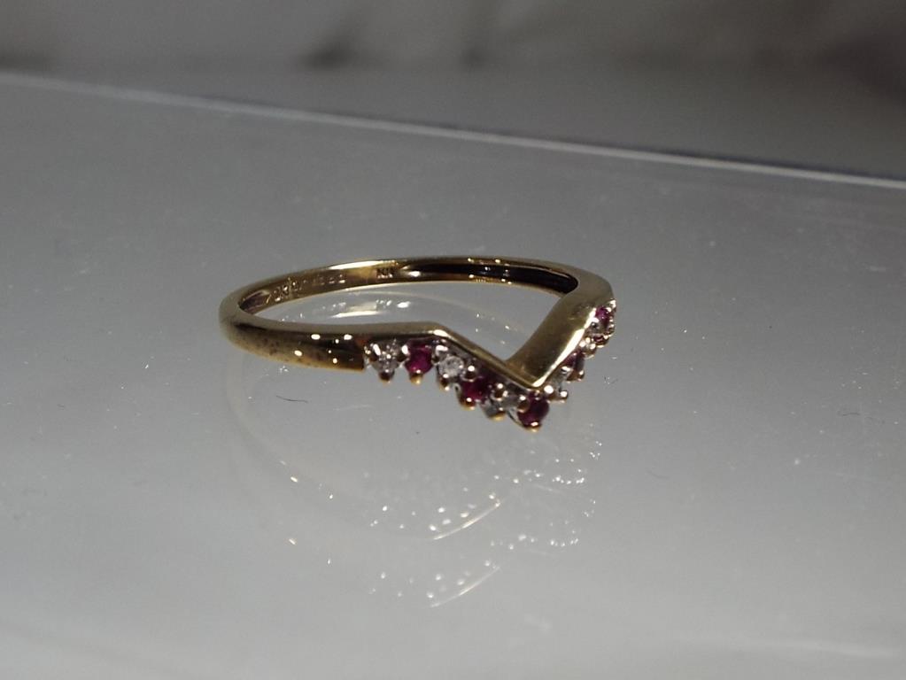 A lady's hallmarked 9 carat gold, ruby and diamond wishbone ring, size S, approx weight 1.