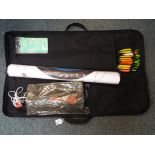 An archery case with paper targets, a petron bowstinger and 25 target / practice arrows,