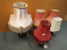 Five table lamps with shades, two of whi