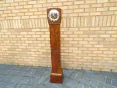 A walnut cased granddaughter clock, West
