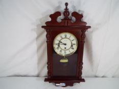 A mahogany cased wall clock, Roman numer