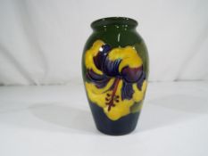 Moorcroft Pottery - a baluster vase deco