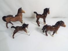 Beswick Pottery - A group of 4 small equ