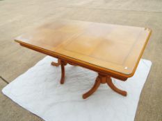 A large extendable dining table with inl