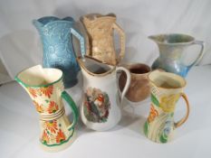 Seven early 20th century water jugs to i