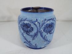 Moorcroft Pottery - A Florianware lidded pot in the "Poppies" pattern, stamped MacIntyre Burslam,