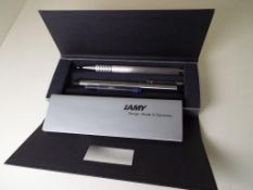 Lamy - a pen and pencil set with spare ink cartridge,