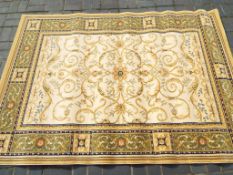 A good quality floor rug with floral decoration on cream ground approximately 230 cm x 160 cm