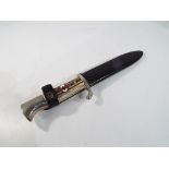 A Hitler youth dagger with horn handle and metal sheath, 14 cm blade, overall length 24 cm,
