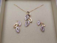 A 9 carat gold 20 pt diamond set leaf earrings and necklace set, approx 4.