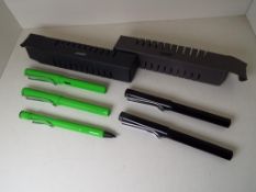 Lamy Safari - a green pen, pencil and rollerball writing set, and a black pen and rollerball set,