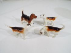 Beswick Pottery - A group of 4 foxhounds by Beswick Pottery,