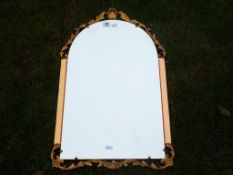A gilt framed bevel edged wall mirror,