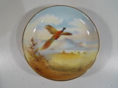 Minton - A pin dish by Minton decorated with a pheasant in flight, stamped to the base,
