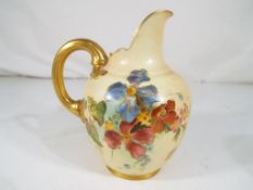 Royal Worcester - A small blush ivory Royal Worcester milk jug with a floral decoration,