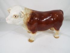 A good quality ceramic model of a bull,