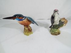 Beswick Pottery - two Beswick figurines of birds to include Lesser Spotted Woodpecker model No.
