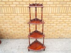 A reproduction mahogany four tier whatnot,