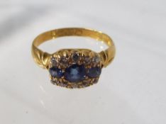A lady's 18 carat gold ring set with sapphires and diamonds, approx 3.