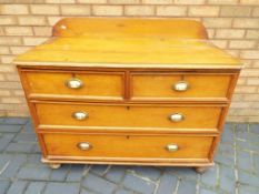 A 2 over 2 antique pine chest of drawers,