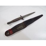 A third pattern WW2 Fairbairn-Sykes fighting knife (SAS knife) unmarked with brass handle in